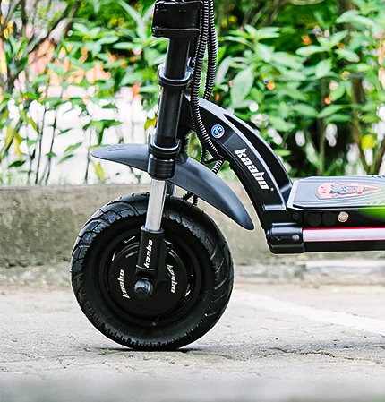 Close-up of black electric scooter front wheel