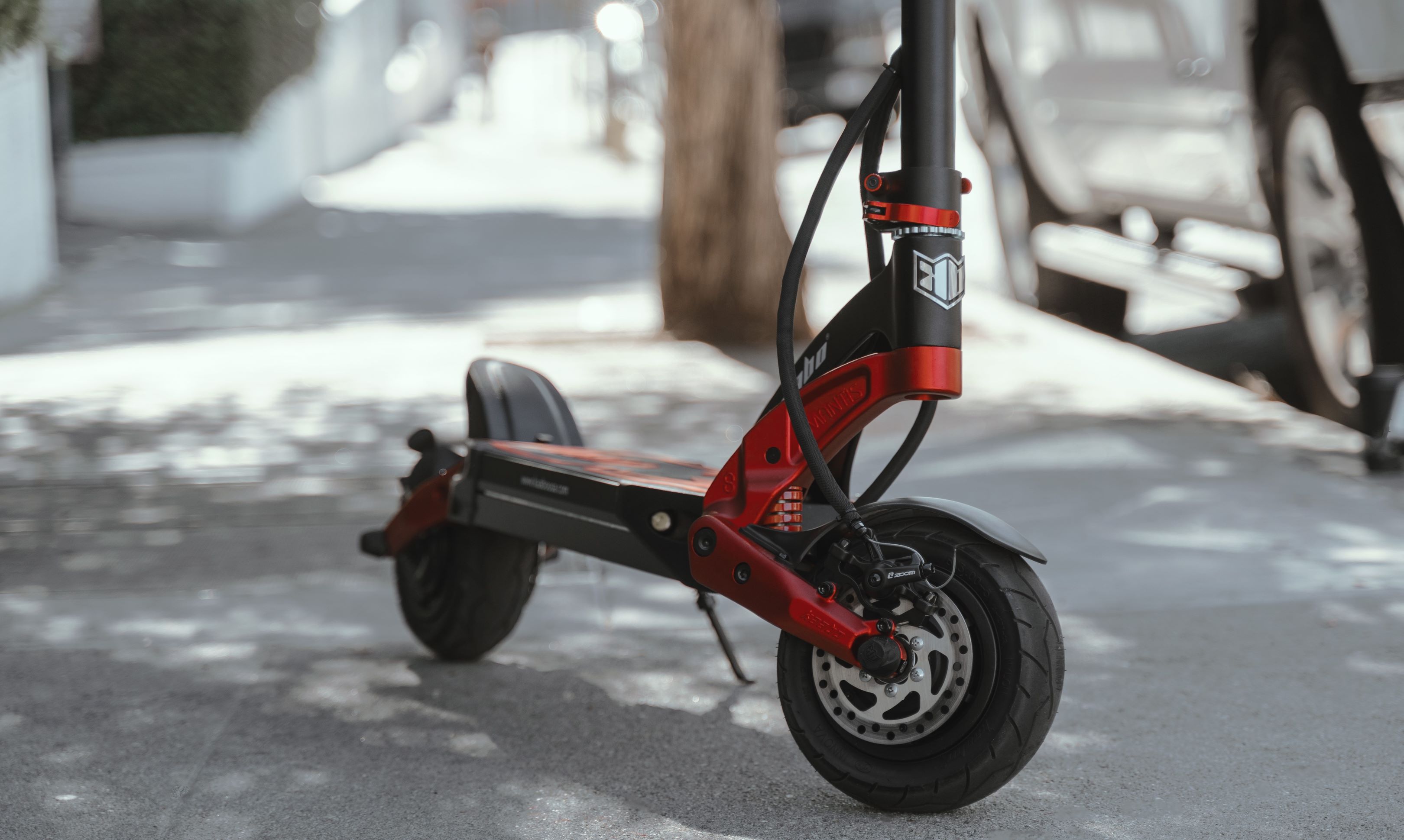 Electric scooter front wheel on sidewalk