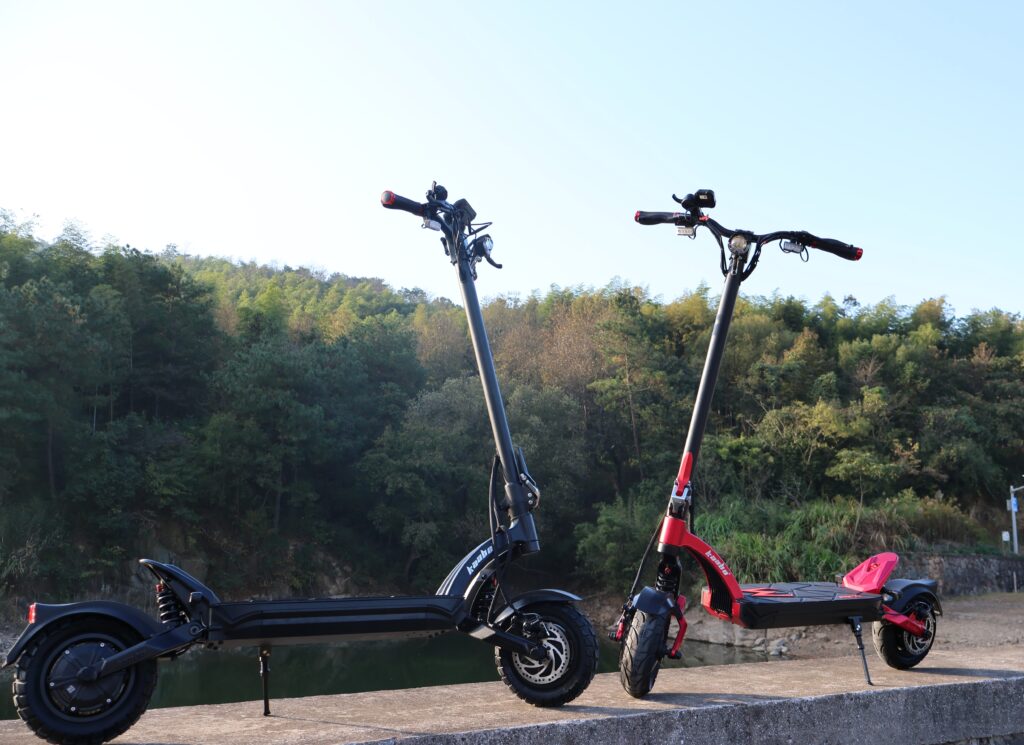 Two electric scooters by a lake
